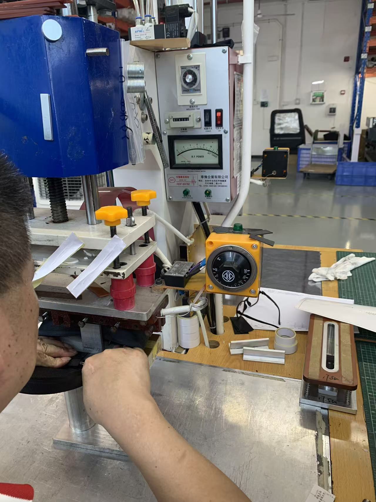 RF welding machine fusing PVC tarpaulin seams at Sealock motorcycle saddlebag factory