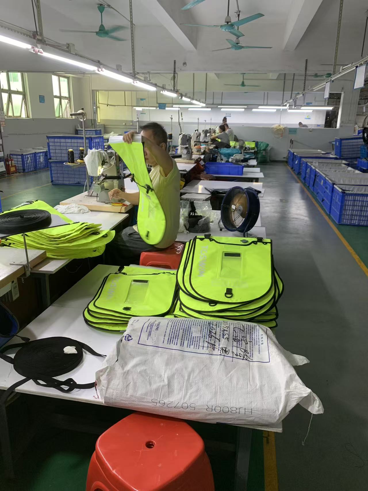 Swim buoy components staged along the assembly line